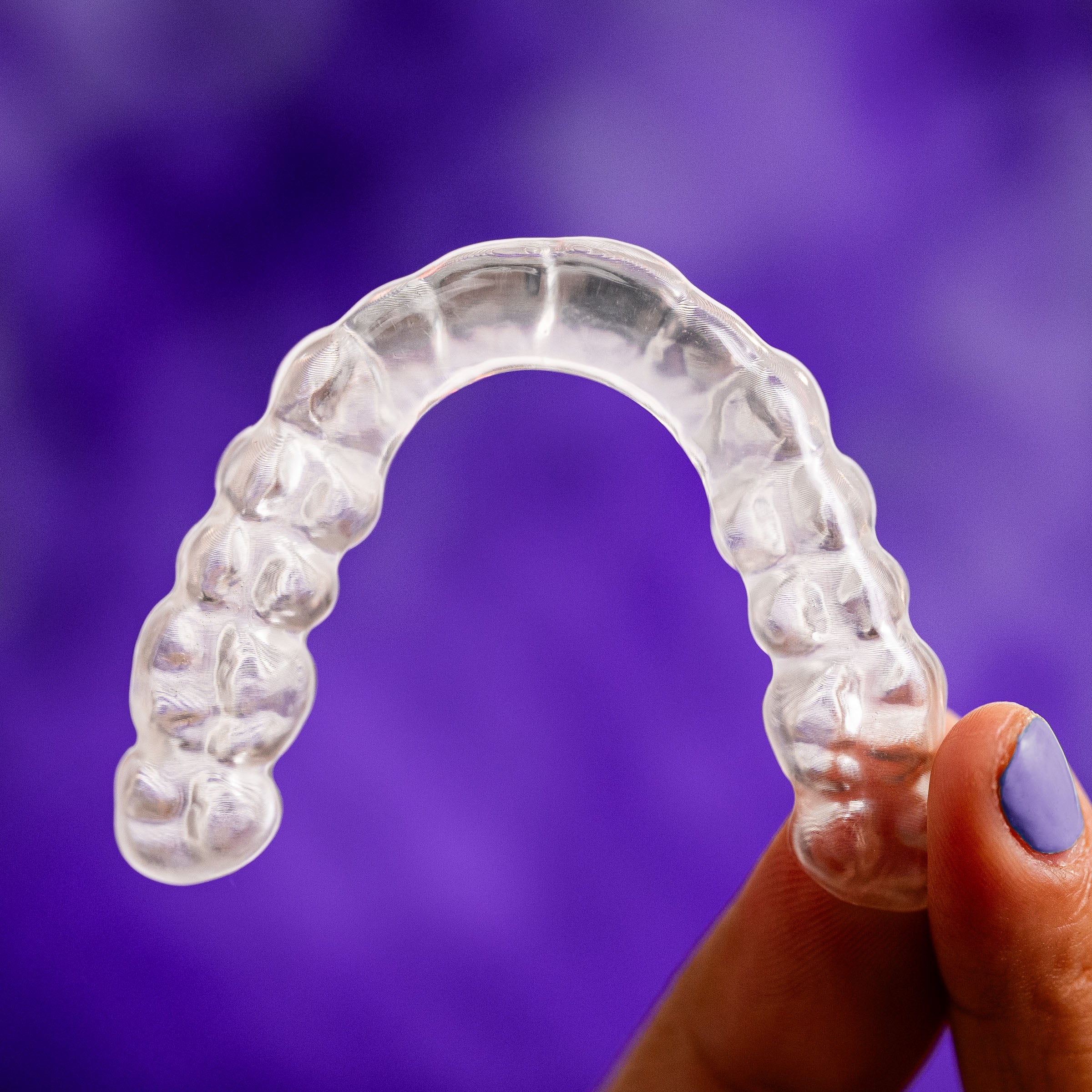 AccuGUARD Flat Plan appliance from Great Lakes Dental Technologies over abstract background