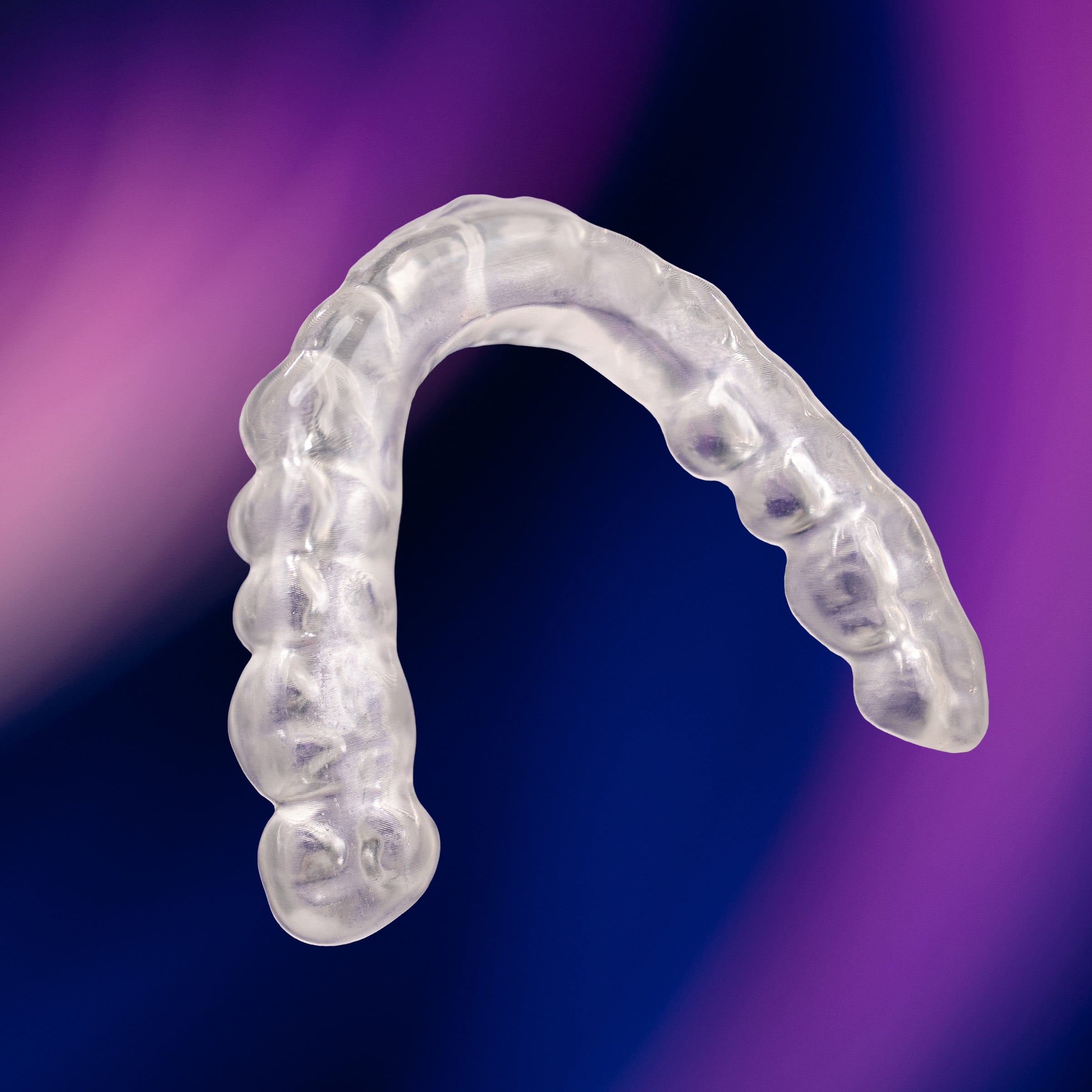 AccuGUARD Flat Plan appliance from Great Lakes Dental Technologies over abstract background